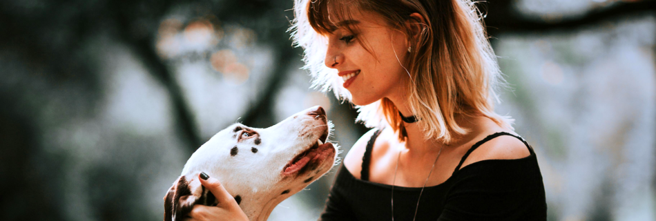 Pet Owner looking kindly on cute dog