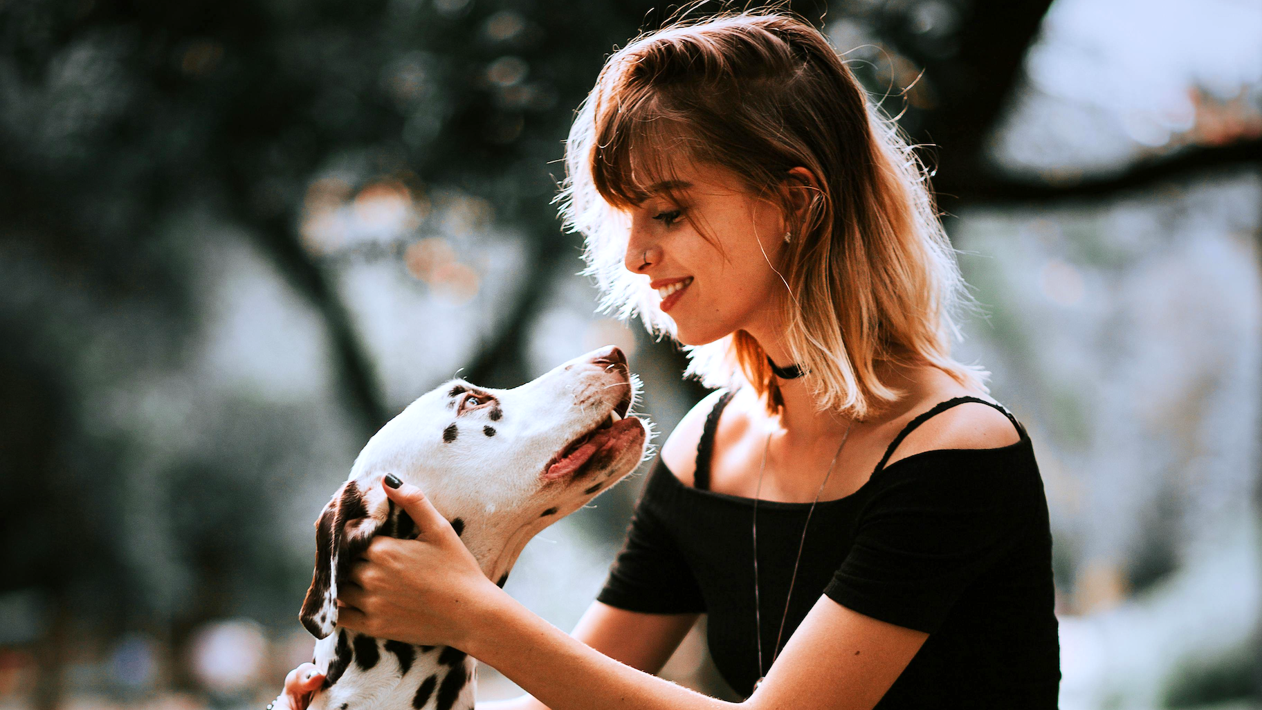 Pet Owner looking kindly on cute dog